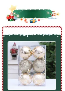 Detail view of gold Christmas ball ornaments with glitter and painted textures in a box