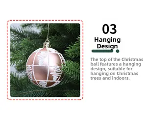 Detail of rose gold Christmas ball with snowflake pattern and hanging gold cord