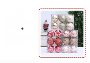 Close-up of glitter and painted Christmas tree ornaments in red and gold finishes