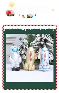 Close-up of astronaut and metallic zeppelin hanging ornaments for Christmas trees