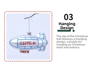 Detail of silver Zeppelin Christmas tree ornament with blue lines and red glitter lettering