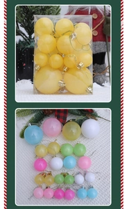 Détail de boules de Noël aux couleurs macaron en plusieurs tailles avec boîte de rangement
