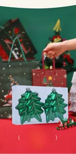 Detail of green metallic finish Christmas tree ornaments in a two-piece set for holiday decor