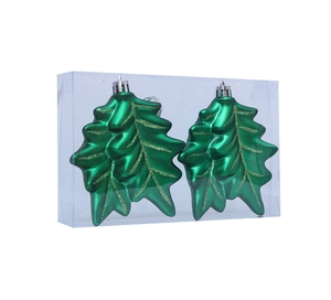 Detail of green holly leaf Christmas ornaments with gold glitter veins in a clear box