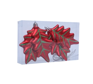 Macro view of two leaf-shaped Christmas ornaments with red finish and green glitter details