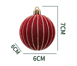 Detail of a dark red velvet Christmas ball with gold glitter lines and 7cm height scale