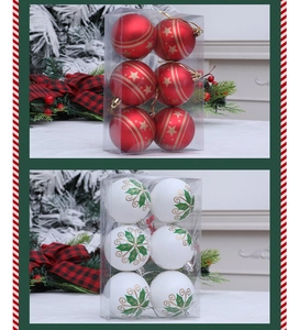 Detalle de bolas de Navidad pintadas en rojo y blanco con estrellas en caja de regalo