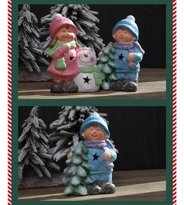 Detailed view of cute Christmas figurines with pink and blue outfits and textured finish