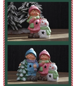 Detail of Christmas ceramic dolls with glitter texture featuring boy, girl and snowman