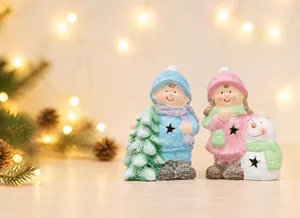 Detail of magnesium oxide Christmas figurines with festive winter kids and a snowman