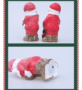Detail of Christmas Santa ceramic figurine base with power switch and snowy texture