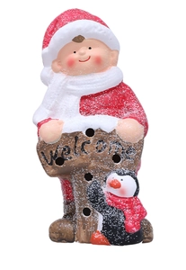 Macro detail of Christmas ceramic figure with Welcome sign and snowy texture decoration