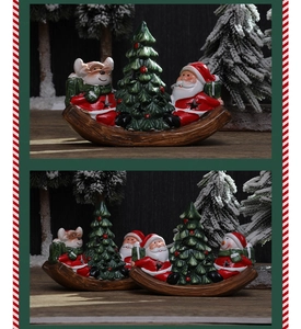 Detail of Santa and snowman resin ornaments with festive hand-painted rocking base