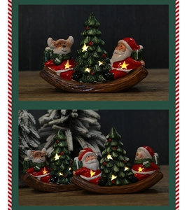 Close-up of ceramic rocking horse with Santa, snowman and star-shaped LED cutouts