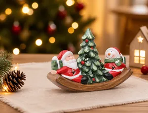 Detail of Christmas ceramic ornaments featuring Santa and Snowman on a rocking base