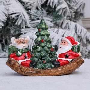 Lighted Christmas ceramic boat decoration with Santa and reindeer on wooden rocking base