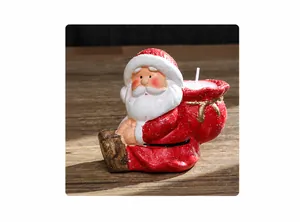 Detailed close-up of a Santa Claus resin candle holder with a white pillar candle inset