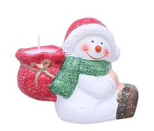 Detail of Christmas snowman ceramic candle holder with red hat and glitter finish
