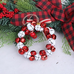 Christmas wreath with red and white metal bells, striped bow and jute rope for tree decor