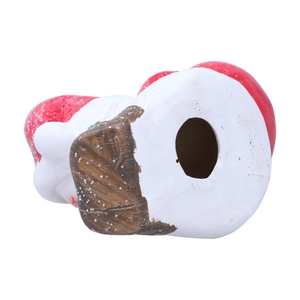 Bottom view of Christmas ceramic Santa figurine showing hollow base and red details