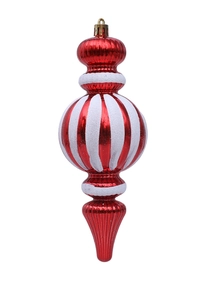Detalle de adornos navideños de huso rojos y blancos con purpurina para el árbol