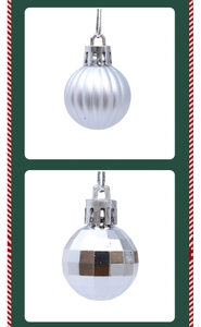 Detailed view of silver Christmas baubles with matte stripes and faceted disco textures