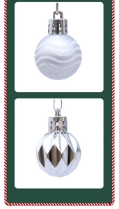 Close-up of silver Christmas balls with glitter waves and diamond-cut patterns