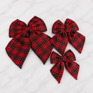 Three sizes of red and black plaid bows for Christmas tree decoration and festive styling