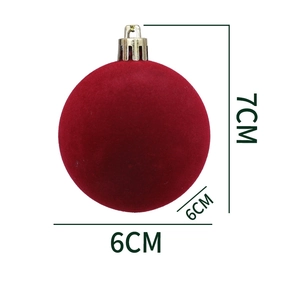 Detail view of a 6cm dark red flocked Christmas ornament ball with a silver hanging cap