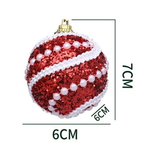 Detail of a 6cm red glitter Christmas ball with white pearl accents and wave trim