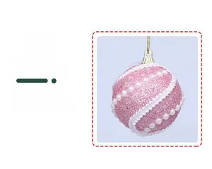 Detailed view of pink glitter Christmas ball with white lace and pearl chain accents