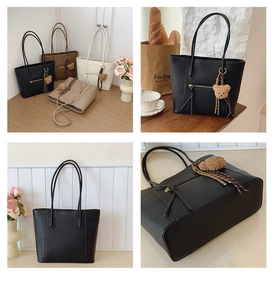 Detail of large tote bags in four colors with bear charms and lychee leather texture