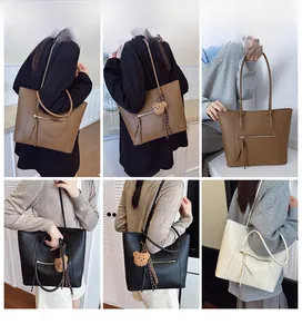 Three colors of large tote bags with plush bear charms shown on models in home setting