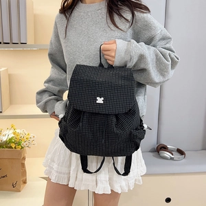 Lightweight black checkered drawstring backpack for women featuring a unique puzzle metal buckle
