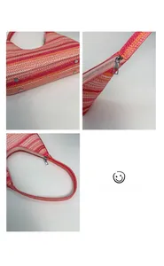 Detailed macro view of multi-color woven shoulder bag with protective base metal studs