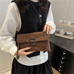 Chic brown leopard print envelope clutch bag with black square buckle and wristlet strap