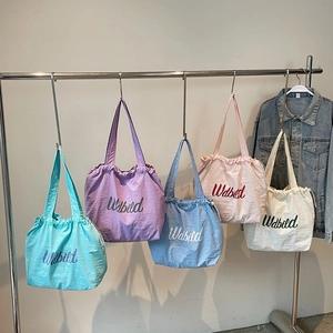 Lightweight nylon drawstring tote bags in five vibrant pastel colors for versatile commuting