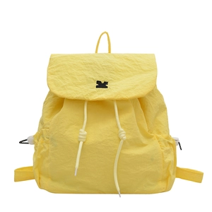 Bright yellow drawstring backpack with flap closure and pleated nylon fabric texture