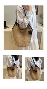 Dettaglio della trama intrecciata e delle finiture in pelle nera di questa borsa tote