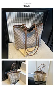 Detail view of khaki printed tote bag set with geometric grid pattern and inner pouch