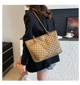 Brown retro checkered tote bag set with matching mini pouch shown on shoulder