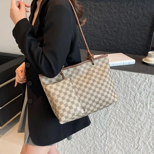 Retro plaid tote bag set with brown leather trim and matching inner pouch on model