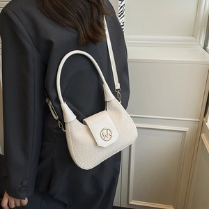 White woven half-moon shoulder bag with golden M metal buckle and adjustable strap