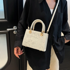 White jacquard handbag with embossed floral pattern and woven handle for women