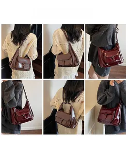 Detail shots of glossy faux leather hobo tote bag in dark brown and wine red