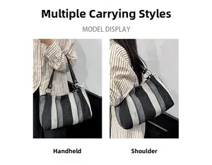 Detail view of large vertical striped knit tote bag with black faux leather handles
