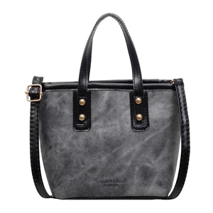 Graue Patchwork-Eimertasche mit schwarzen Griffen und verstellbarem Schultergurt