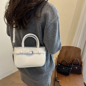 Minimalist white PU leather crossbody handbag with decorative buckle and dual handles