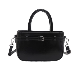 Classic black glossy faux leather handbag with silver hardware and adjustable strap