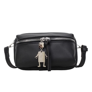 Minimalist black leather crossbody bag with a unique silver robot pendant detail